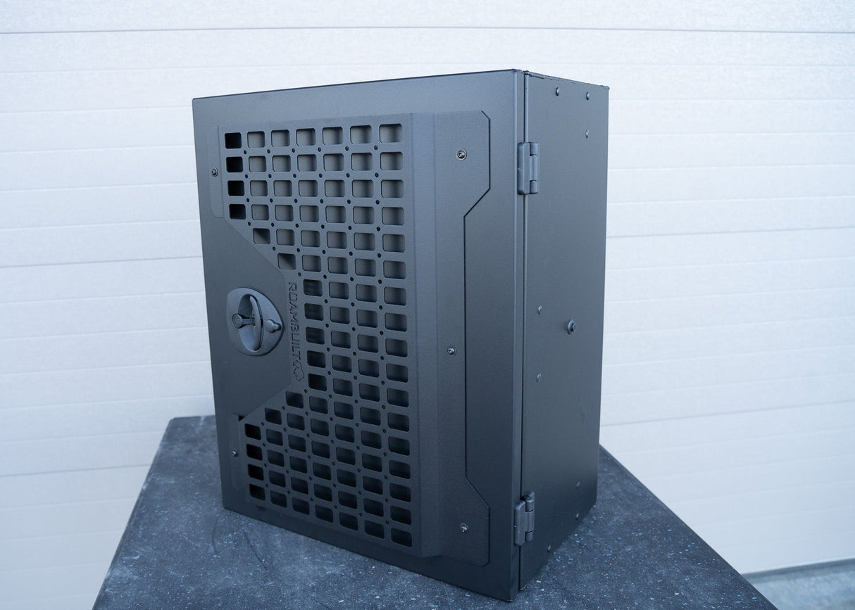 Angled view of the Universal Aluminum Storage Box highlighting the front MOLLE panel and black lockable compression latch, showcasing its rugged design, accessory mounting capability, and secure closure system.