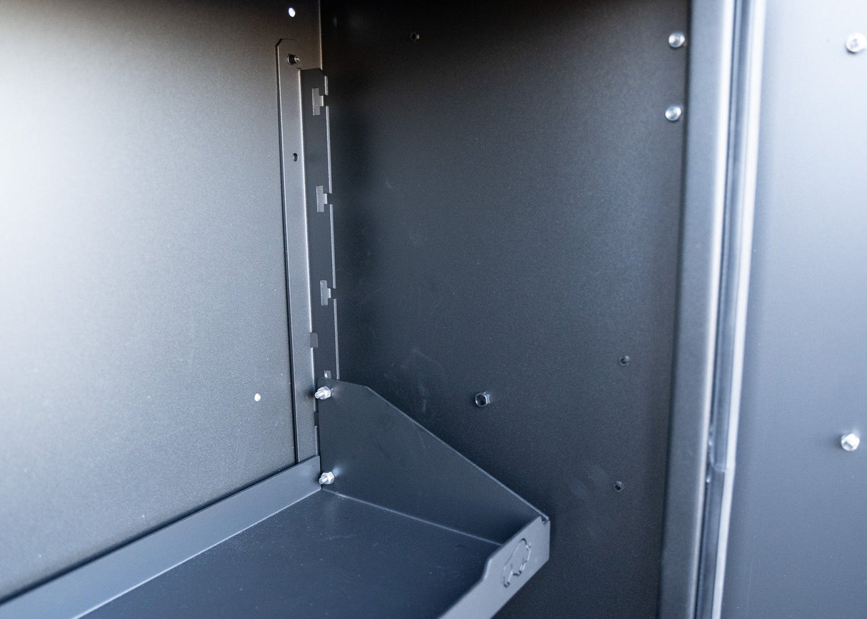 Close-up view of the adjustable shelf inside the Universal Aluminum Storage Box, emphasizing its customizable height settings and sturdy aluminum construction for flexible, secure storage.