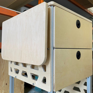 tetravan moab bracket attached to cabinet in campervan with drop down table and drawer system ventilated campervan cabinet 8020 framing