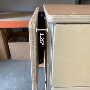 tetravan moab bracket attached to cabinet in campervan with drop down table and drawer system ventilated campervan cabinet 8020 framing gap 1.25"