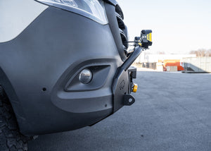 Side profile of a Mercedes-Benz Sprinter van featuring the ROAMBUILT LoPro Front Bumper, highlighting its lightweight aluminum shell and snug fit that adds only 3 inches of bulk, seamlessly aligning with the vehicle's body lines.