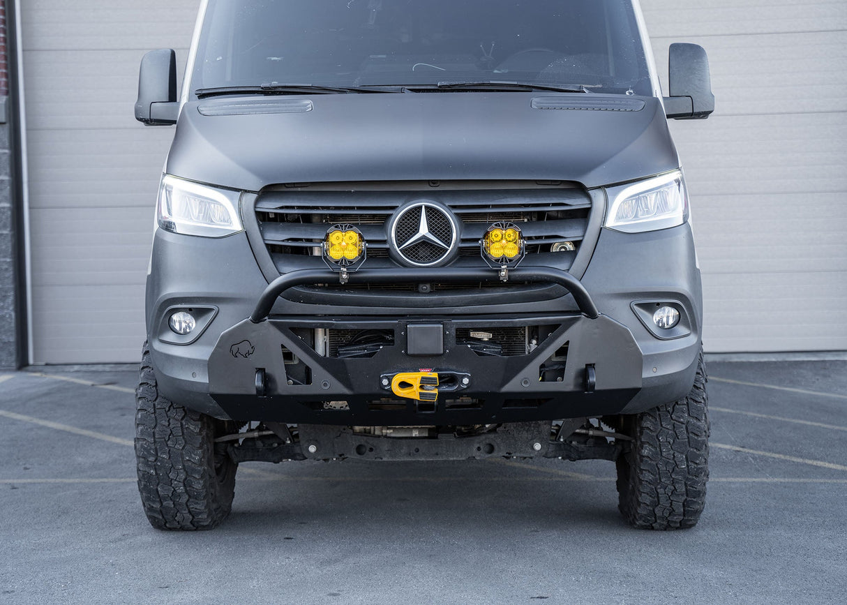 Front view of a Mercedes-Benz Sprinter van equipped with a ROAMBUILT LoPro Front Bumper, showcasing its lightweight aluminum design, integrated bull bar, and seamless fit with the vehicle's body lines.
