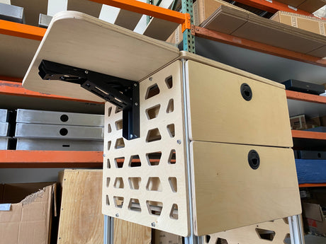 tetravan moab bracket attached to cabinet in campervan with drop down table and drawer system ventilated campervan cabinet