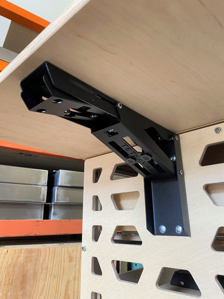 tetravan moab bracket attached to cabinet in campervan